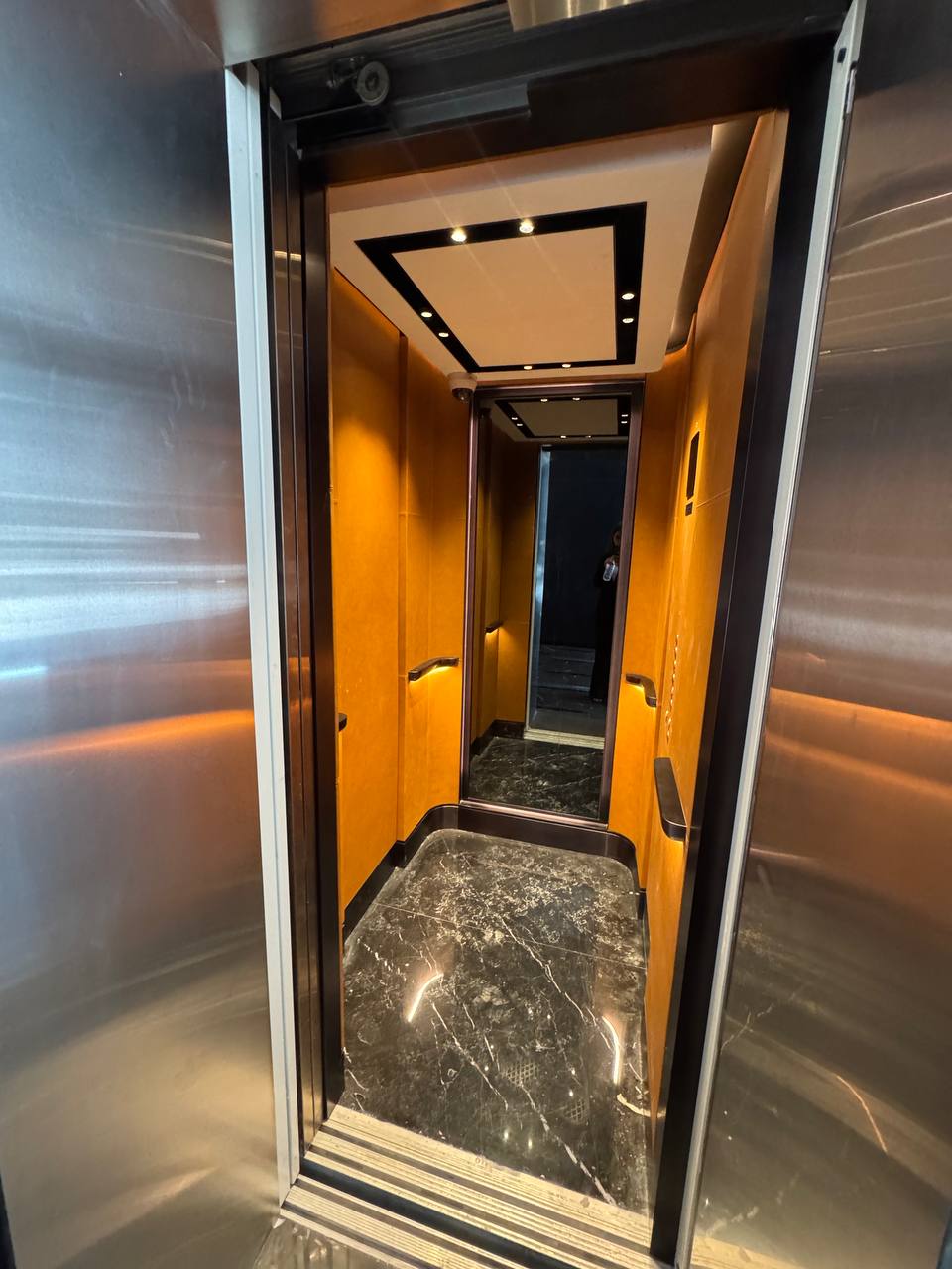 ARC Design – Luxury hotel lobby with marble flooring and illuminated feature wall at G1 Pagani Hotel, Business Bay Dubai | Interior design UAE