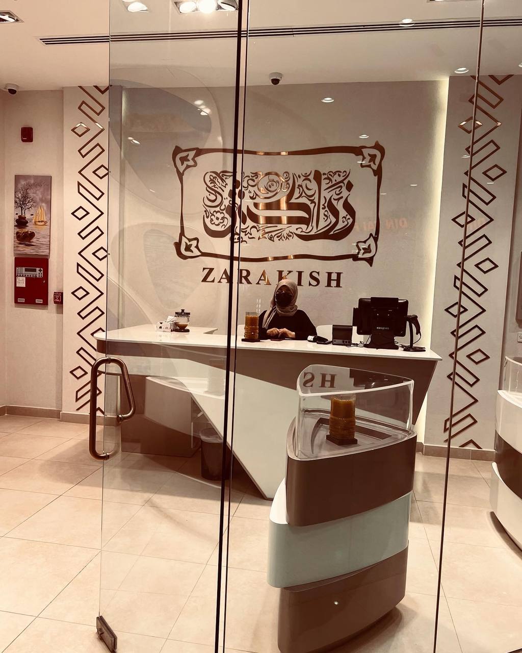Zarakish Dubai – Deira City Center | Modern reception counter and luxury retail interior